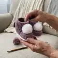 Plush Booties with Pompoms Pattern step 4 - final assembly and finishing